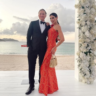 Collette Dubrow's father, Dr Terry Dubrow, is in a black tuxedo, and his mother, Heather Dubrow, is in a light orange outfit.